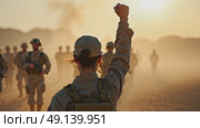 A woman in a military uniform stands tall, her right arm is raised in a fist pump after a successful mission. The background filled with tired but Happy colleagues in the military. Стоковое AI-видео, аниматор Sergey Grishin / Фотобанк Лори