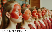 A group of young women with elaborate face paint designs, showcasing their creativity and cultural expressions. Стоковое AI-изображение, AI-художник Данила Большаков / Фотобанк Лори