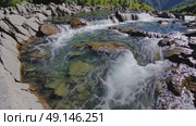 Crystal-clear water flows over rocks in a mountain stream — great for nature, eco-tourism, summer, or meditation and relaxation themes. Стоковое AI-видео, аниматор Башкирова Анна / Фотобанк Лори