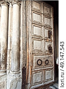 Entrance door in Church of Holy Sepulcher. close up. Стоковое фото, агентство Ingram Publishing / Фотобанк Лори
