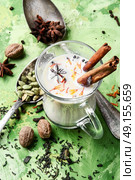 Masala tea ingredients. glass of Indian tea with milk and spicy spices. Стоковое фото, агентство Ingram Publishing / Фотобанк Лори