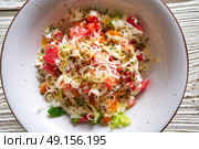 Cesar caesar salad with tomato cheese lettuce and sauce. Стоковое фото, агентство Ingram Publishing / Фотобанк Лори