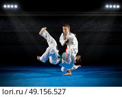 Children martial arts fighters at sports hall. Стоковое фото, агентство Ingram Publishing / Фотобанк Лори