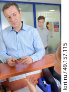 man in the front desk. Стоковое фото, агентство Ingram Publishing / Фотобанк Лори