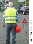 senior aged man holding gas can to refill his car. Стоковое фото, агентство Ingram Publishing / Фотобанк Лори