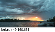 Motorboat in the lake, Lake of the Woods, Ontario, Canada. Стоковое фото, агентство Ingram Publishing / Фотобанк Лори