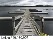 Wooden jetty leading to sea, Guysborough, Nova Scotia, Canada. Стоковое фото, агентство Ingram Publishing / Фотобанк Лори