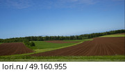 Scenic view of ploughed field, Breadalbane, Prince Edward Island, Canada. Стоковое фото, агентство Ingram Publishing / Фотобанк Лори