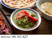 Palak Panner indian recipe food on wooden table. Стоковое фото, агентство Ingram Publishing / Фотобанк Лори