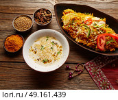 Chicken Biryani indian recipe with white soup and spices. Стоковое фото, агентство Ingram Publishing / Фотобанк Лори