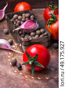 domestic pickle tomato. Summer harvest tomato and pepper peas with garlic for pickling. Стоковое фото, агентство Ingram Publishing / Фотобанк Лори