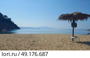 Beautiful Micros Aselinos beach on Skiathos island in Greece, umbrella, summer day in June. Стоковое фото, агентство Ingram Publishing / Фотобанк Лори