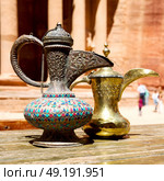 in the site of petra jordan the traditional coffe container isolated on a table. Стоковое фото, агентство Ingram Publishing / Фотобанк Лори