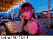 A young woman with distinctive, colorful hair and tattoos sits at an outdoor diner table, illuminated by string lights, as dusk falls in the background. Стоковое AI-изображение, AI-художник Данила Большаков / Фотобанк Лори