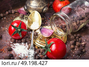 Homemade pickle tomato. tomato,pepper peas and garlic for pickling to the old national recipe. Стоковое фото, агентство Ingram Publishing / Фотобанк Лори