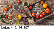 domestic pickle tomato. tomato,pepper peas and garlic for pickling in retro wooden box. Стоковое фото, агентство Ingram Publishing / Фотобанк Лори