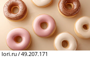 Simplistic design with pastel donuts arranged symmetrically on beige surface. Стоковое AI-изображение, AI-художник ALLA YURTAYEVA / Фотобанк Лори