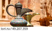 in the site of petra jordan the traditional coffe container isolated on a table. Стоковое фото, агентство Ingram Publishing / Фотобанк Лори