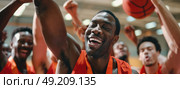 Several men in orange vests standing together and holding basketballs. Стоковое AI-изображение, AI-художник Данила Большаков / Фотобанк Лори