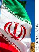in iran blur  iranian waving flag  the blue sky and wind. Стоковое фото, агентство Ingram Publishing / Фотобанк Лори
