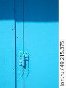 in the old wall a hinged window blue  wood and         rusty metal. Стоковое фото, агентство Ingram Publishing / Фотобанк Лори