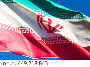 in iran blur  iranian waving flag  the blue sky and wind. Стоковое фото, агентство Ingram Publishing / Фотобанк Лори