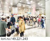 Phu Quoc, Vietnam - April 05, 2025: Long queue of travelers at Phu Quoc Island Airport in Vietnam during peak travel season. Редакционное фото, фотограф Кривошеина Елена Леонидовна / Фотобанк Лори
