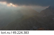 Sunset mountains and dramatic clouds. Стоковое видео, видеограф Михаил Коханчиков / Фотобанк Лори