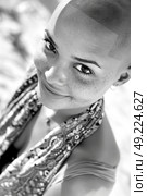 Black and white portrait of a woman with a shaved head, showcasing a bold and unique hairstyle. Стоковое AI-изображение, AI-художник Данила Большаков / Фотобанк Лори