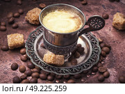 Coffee in the oriental style. Vintage set with a cup of coffee on saucer in oriental style. Стоковое фото, агентство Ingram Publishing / Фотобанк Лори