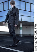 Attractive boy at parking lot. Стоковое фото, агентство Ingram Publishing / Фотобанк Лори