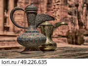 in the site of petra jordan the traditional coffe container isolated on a table. Стоковое фото, агентство Ingram Publishing / Фотобанк Лори