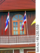 temple   in  bangkok thailand incision red venetian blind and terrace waving flag . Стоковое фото, агентство Ingram Publishing / Фотобанк Лори