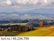 Village on hills of tatra mountain range. Town in the middle of green fields. Стоковое фото, агентство Ingram Publishing / Фотобанк Лори