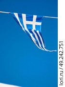 waving greece flag  in the blue sky and      flagpole. Стоковое фото, агентство Ingram Publishing / Фотобанк Лори