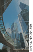 Modern skyscrapers reflect city skyline in bright daylight. Стоковое видео, видеограф Михаил Коханчиков / Фотобанк Лори