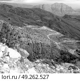  gorge and canyon the deep cloudy sky   in oman the old  mountain . Стоковое фото, агентство Ingram Publishing / Фотобанк Лори