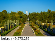 Modern footbridge across the Anhor canal in Navruz park at sunset in summertime, Uzbekistan, Tashkent. Стоковое фото, фотограф Емельянов Евгений Викторович / Фотобанк Лори