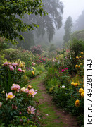 Flowers Bloom in a Misty Garden Path Surrounded by Lush Greenery and Colorful Blossoms. Стоковое AI-изображение, AI-художник Юлия Гапеенко / Фотобанк Лори