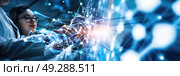 Researcher interacts with a futuristic holographic display of connected nodes and data points. Стоковое AI-изображение, AI-художник Данила Большаков / Фотобанк Лори