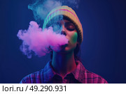 Девушка в шапке выпускает пар. Стоковое AI-изображение, AI-художник Александр Жуков / Фотобанк Лори