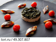 Bota sardine with white garlic pannacotta, codium and osmotized tomatoes. Стоковое фото, агентство Ingram Publishing / Фотобанк Лори