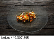 Smoked sardines salad with creamy cheese corn codium and hazelnuts. Стоковое фото, агентство Ingram Publishing / Фотобанк Лори