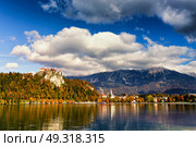 Colorful autumn day on Bled lake, Slovenia. Amazing View On Bled Lake With Mountain Range. Slovenia, Europe. Стоковое фото, агентство Ingram Publishing / Фотобанк Лори