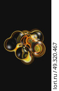 Abstract yellow orange bubbles mix on black background. Vertical video seamless animation loop. Lossless quality. 3D-rendering. Стоковая анимация, аниматор Евгения Шмыкова / Фотобанк Лори