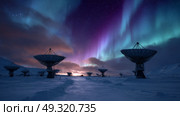 Snow-covered radar dishes facing the aurora sky Life in permafrost conditions, climate change problems on the planet. Global warming. Стоковое AI-изображение, AI-художник ALLA YURTAYEVA / Фотобанк Лори
