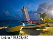 Puerto Morelos sunset bent lighthouse in Riviera Maya of Mayan Mexico. Стоковое фото, агентство Ingram Publishing / Фотобанк Лори