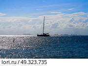 Cancun hotel zone from Isla Mujeres island sunset sailboat Riviera Maya in Mexico. Стоковое фото, агентство Ingram Publishing / Фотобанк Лори