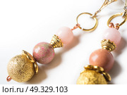 gold handmade earrings with pink semipreciouses. nephritis and variscite. Стоковое фото, агентство Ingram Publishing / Фотобанк Лори