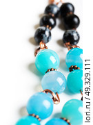 jewerly with chalcedony and obsidian around white background. Стоковое фото, агентство Ingram Publishing / Фотобанк Лори